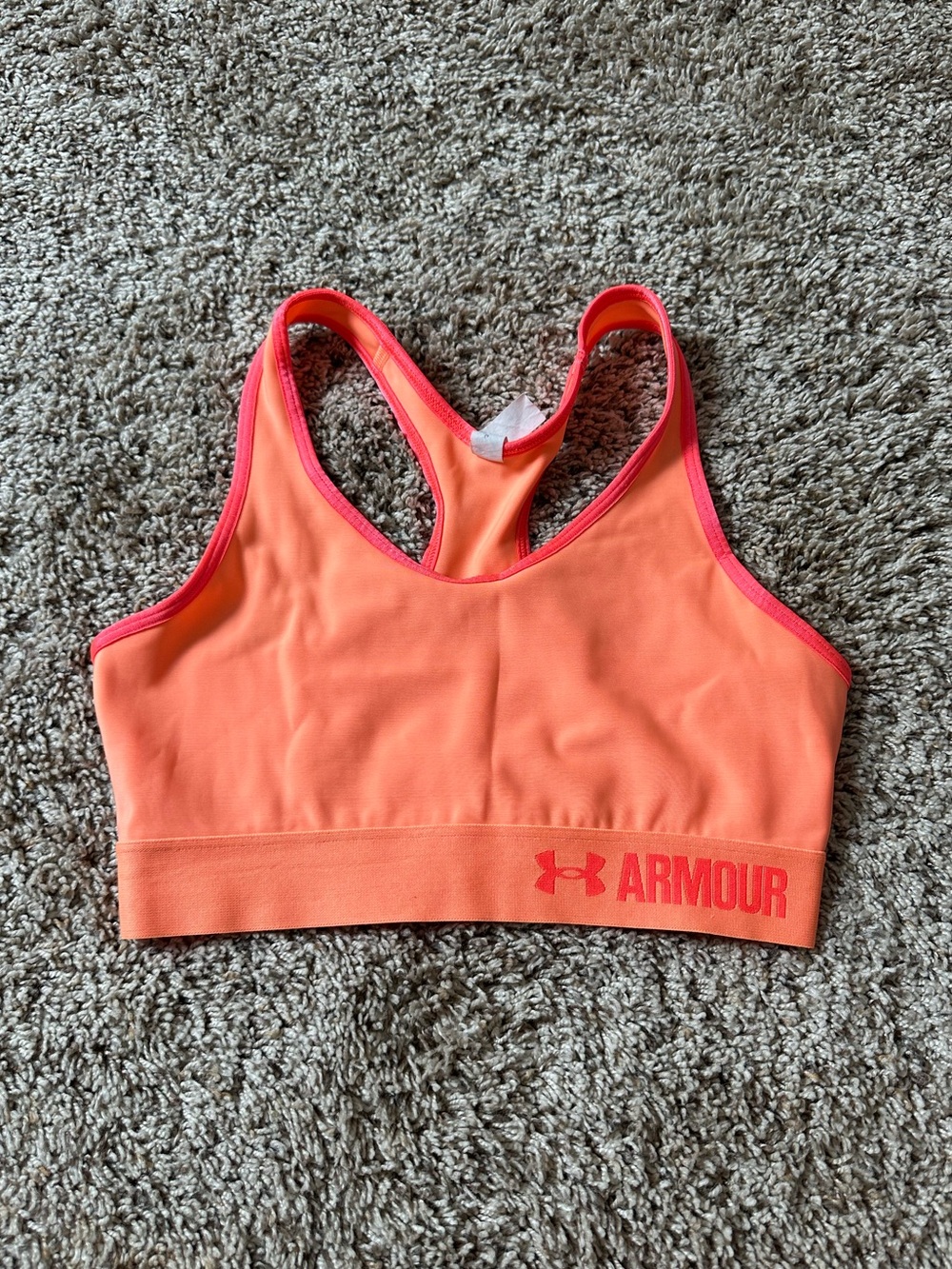 Women’s orange Under Armour sport bra